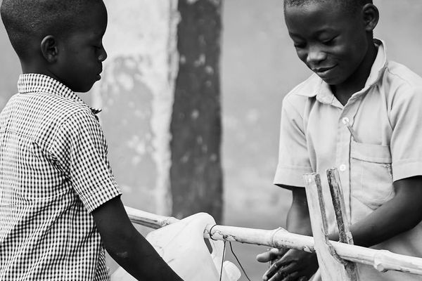 Water bottle and a timer on the floor, indicating a structured practice.